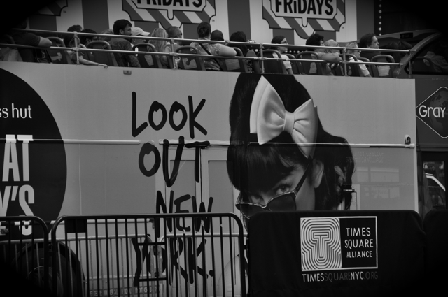 ad on a bus that says "look out NY"