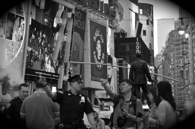 a cop giving directions to some tourists