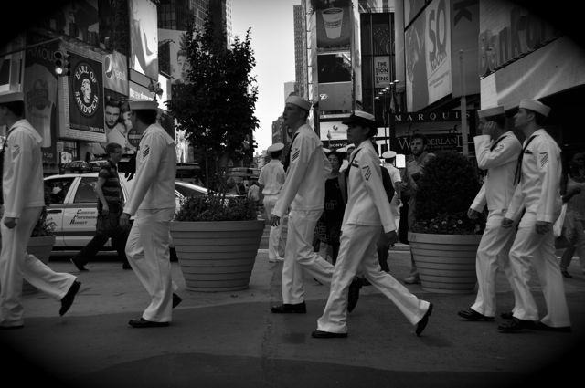 navy men crossing the street