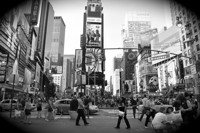 Wide angle shot of Times Square filled with people