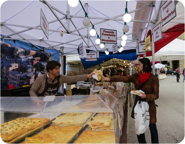 buying Focacia, a flat, oven-baked Italian bread