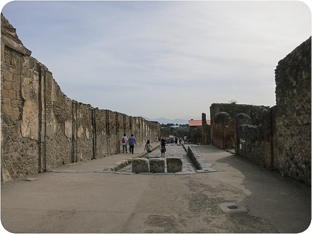 a pedestrian street: the 3 stones jutting out from the center blocked carriages from passing through.