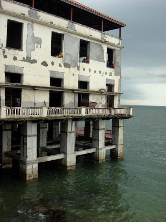 workers taking a lunch break inside this ruined building.