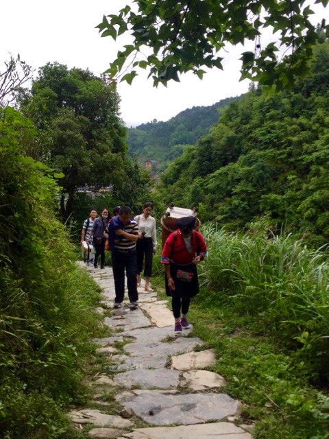 local carrying suitcase Longji rice terraces